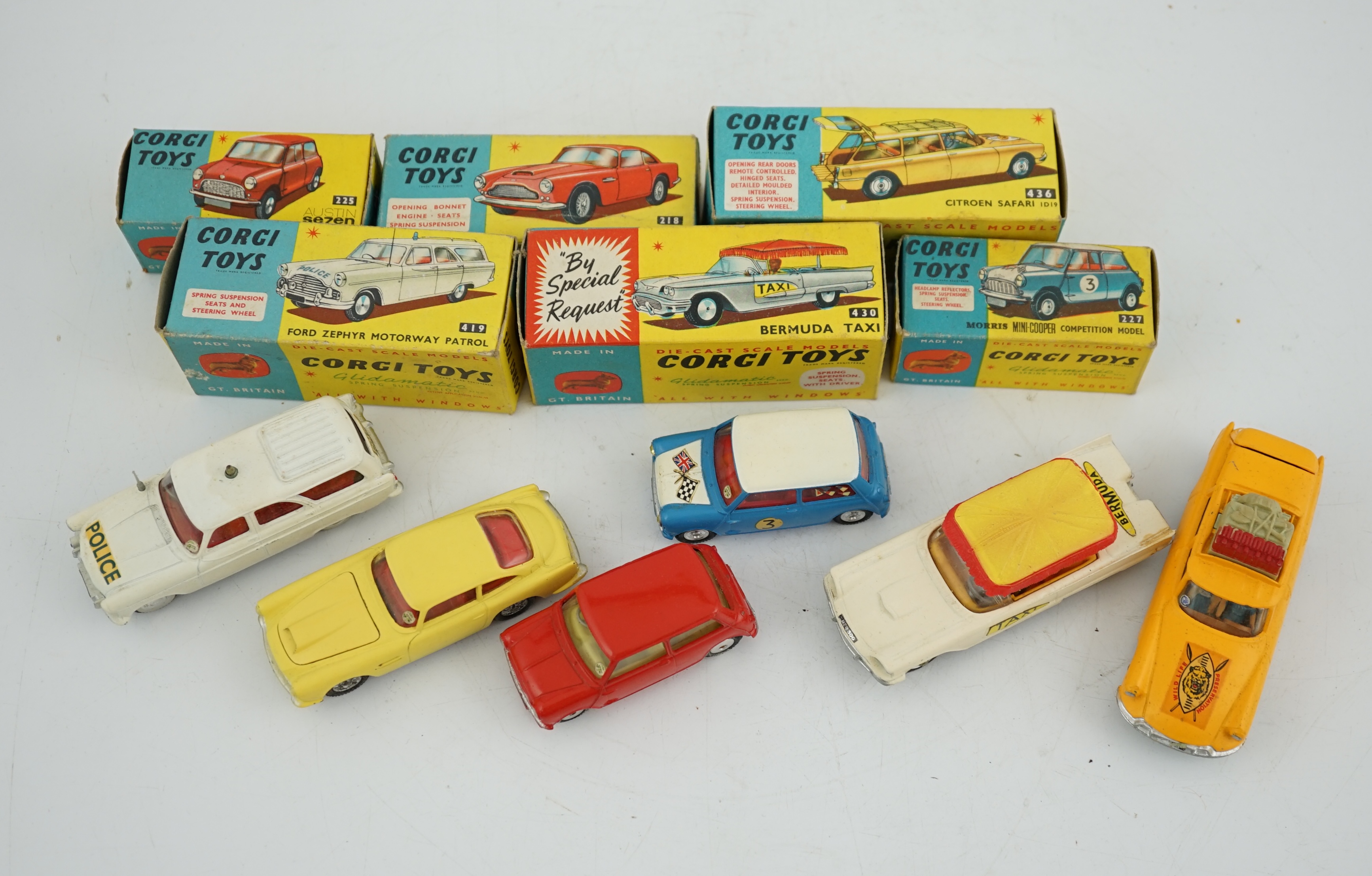 Six boxed Corgi Toys cars; Aston Martin DB4 in yellow (218), Austin seven in red (225), Morris Mini Cooper competition model (227), Ford Zephyr motorway patrol (419), Ford Thunderbird Bermuda Taxi (430), Citroen Safari (